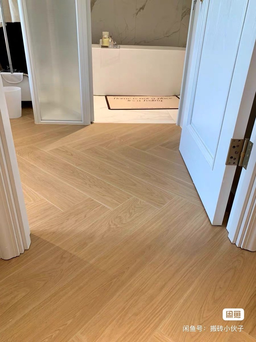 Display showcasing JEES Global flooring options for residential towers, including porcelain and SPC flooring samples.