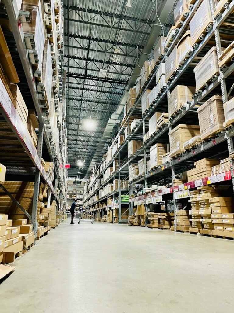 Cardboard cartons stacked on pallets in a consolidation warehouse
