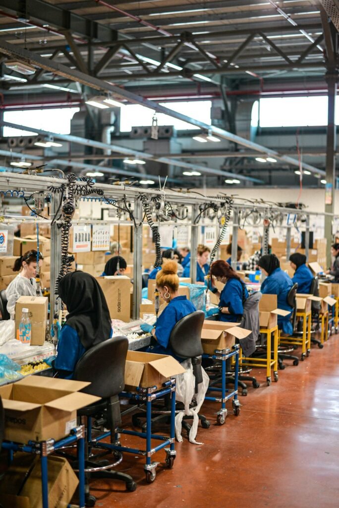 Workers on a factory assembly line producing goods in China